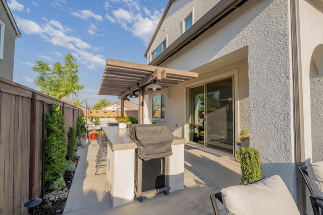 view of patio featuring a pergola, a fenced backyard, and area for grilling