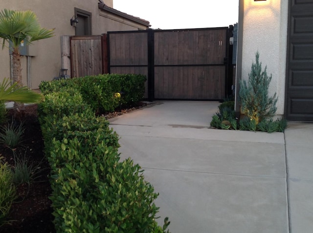 view of gate with fence
