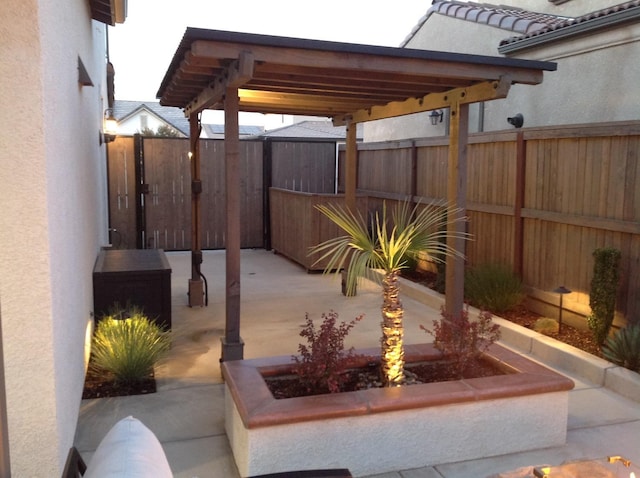 view of patio featuring fence