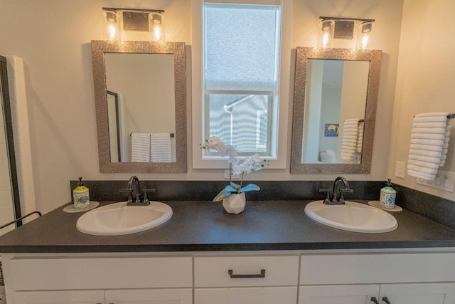 full bath featuring double vanity and a sink