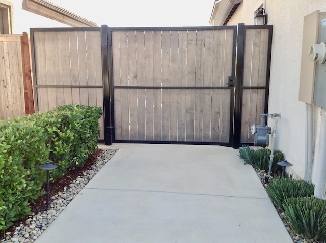 view of gate with fence