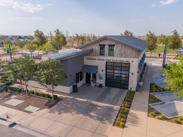 view of front of house featuring concrete driveway and a garage