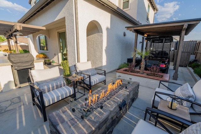 view of patio / terrace featuring a pergola and an outdoor living space with a fire pit