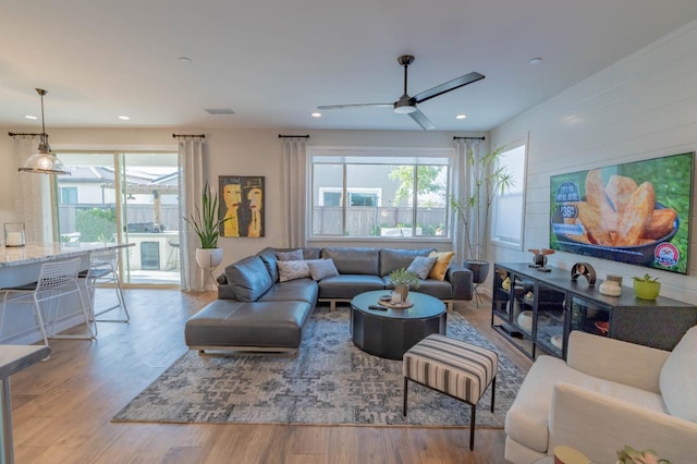 living area featuring ceiling fan, recessed lighting, and wood finished floors
