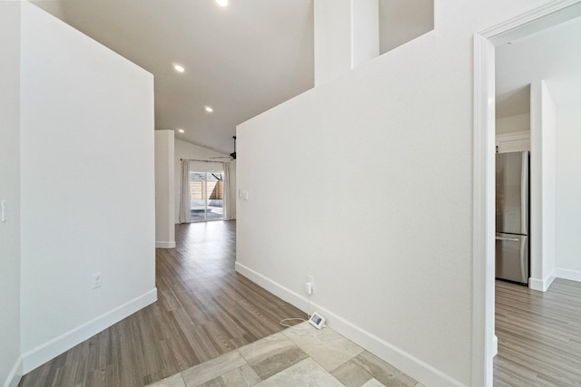 1125 N Purdue Ave, Clovis, CA 93611 - hall featuring baseboards, recessed lighting, wood finished floors, and vaulted ceiling
