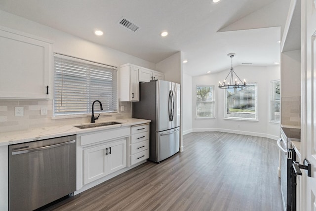 1125 N Purdue Ave, Clovis, CA 93611 - kitchen with stainless steel appliances, a sink, wood finished floors, tasteful backsplash, and white cabinetry
