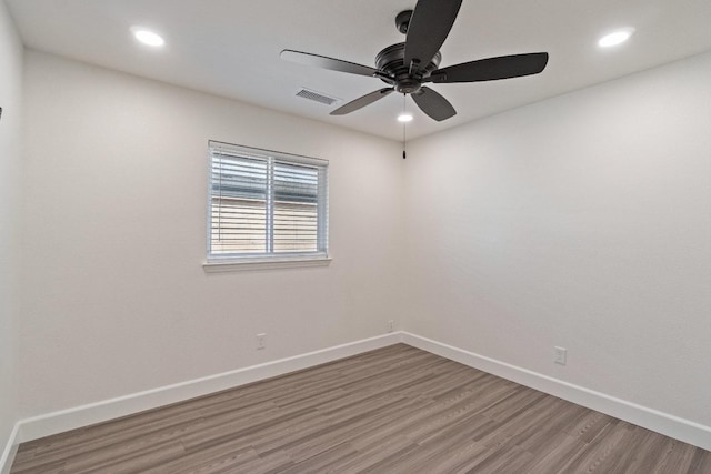 1125 N Purdue Ave, Clovis, CA 93611 - unfurnished room featuring light wood-style floors, baseboards, ceiling fan, and recessed lighting