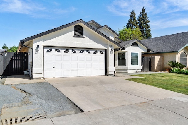 1125 N Purdue Ave, Clovis, CA 93611 - ranch-style home featuring concrete driveway, an attached garage, and stucco siding