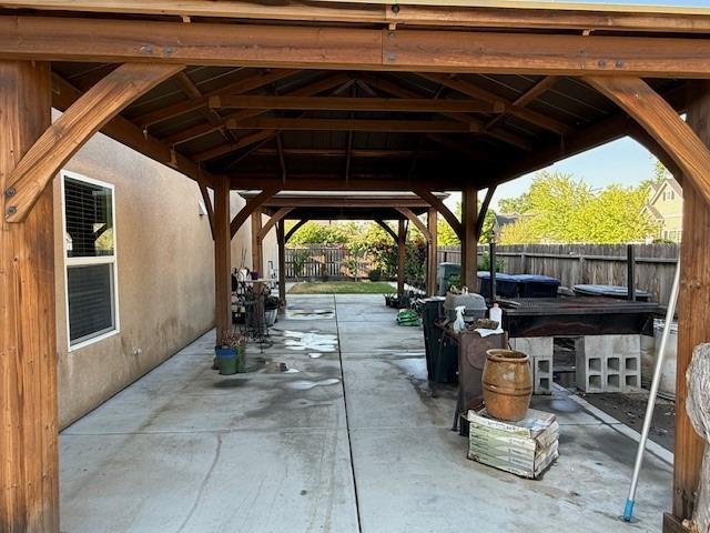view of patio / terrace with a fenced backyard and a gazebo