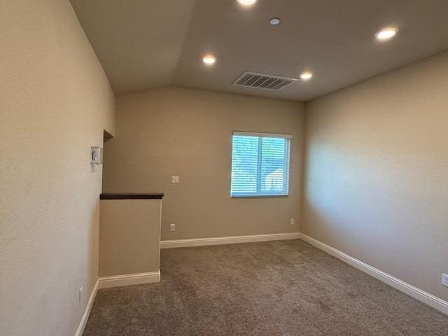 empty room featuring baseboards, carpet, visible vents, and recessed lighting