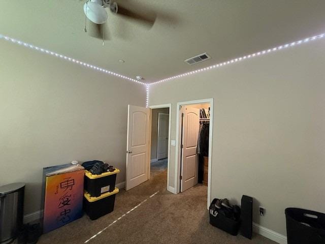 unfurnished bedroom with baseboards, carpet, and visible vents
