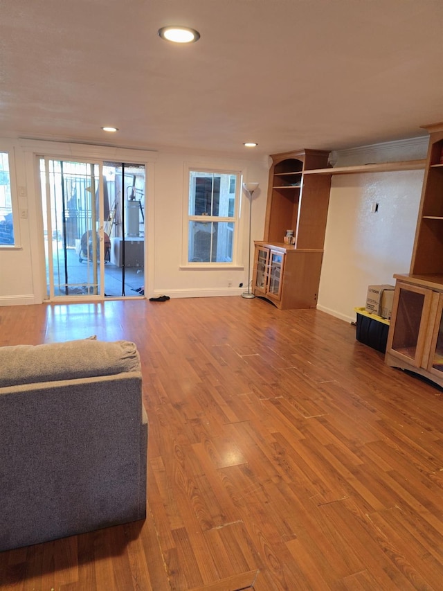 3525 Mayfair Dr N, Fresno, CA 93703 - unfurnished living room with wood finished floors, recessed lighting, and baseboards