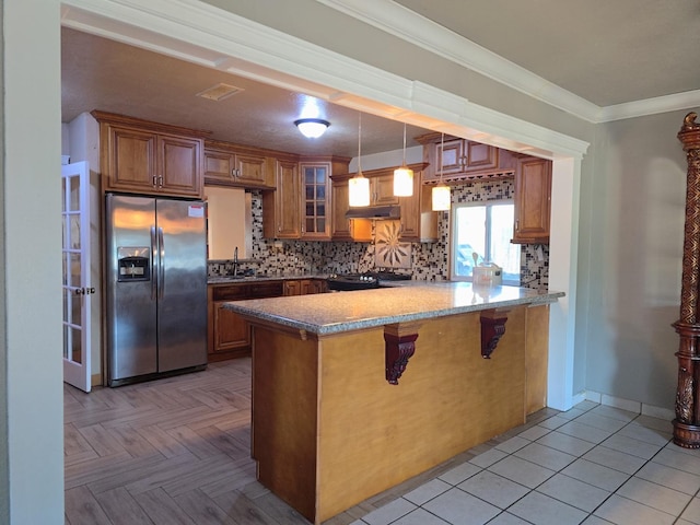 3525 Mayfair Dr N, Fresno, CA 93703 - kitchen with stainless steel refrigerator with ice dispenser, under cabinet range hood, brown cabinets, glass insert cabinets, and a peninsula