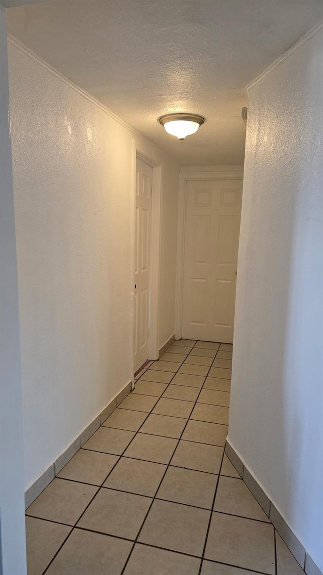 3525 Mayfair Dr N, Fresno, CA 93703 - corridor with light tile patterned floors and a textured ceiling