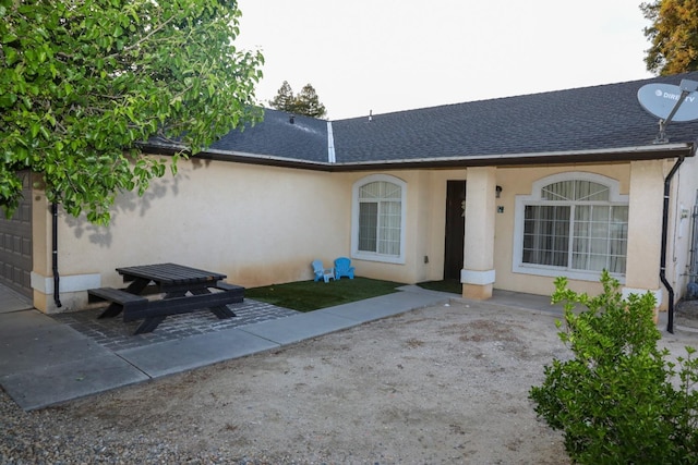 5157 E Truman Ave, Fresno, CA 93725 - view of front of house with stucco siding and roof with shingles