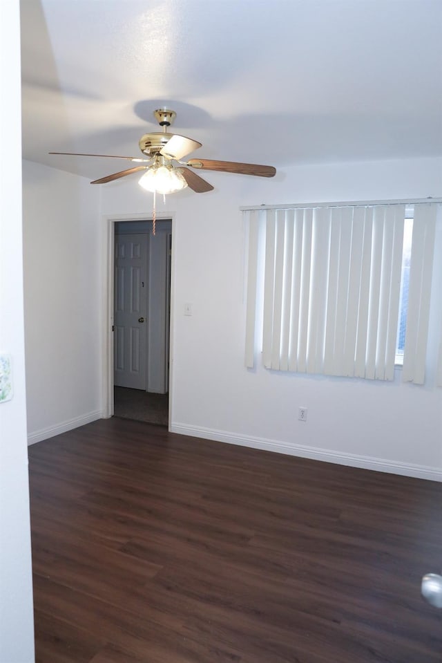 5157 E Truman Ave, Fresno, CA 93725 - spare room with dark wood-style flooring, a ceiling fan, and baseboards