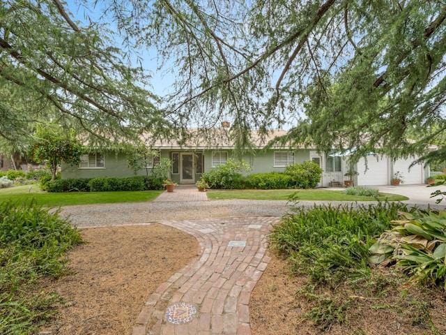 6043 N Forkner Ave, Fresno, CA 93711 - ranch-style home with driveway, stucco siding, a garage, and a front yard