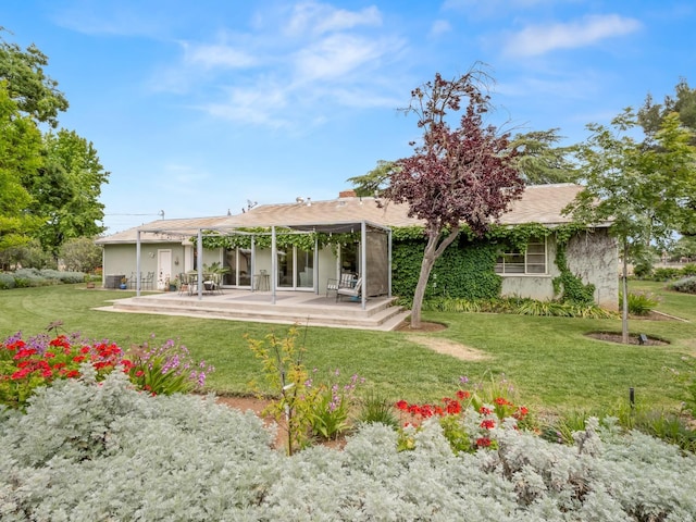 6043 N Forkner Ave, Fresno, CA 93711 - rear view of property with a lawn and a patio area