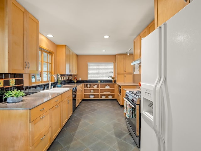 6043 N Forkner Ave, Fresno, CA 93711 - kitchen with white fridge with ice dispenser, range with gas cooktop, a sink, under cabinet range hood, and healthy amount of natural light