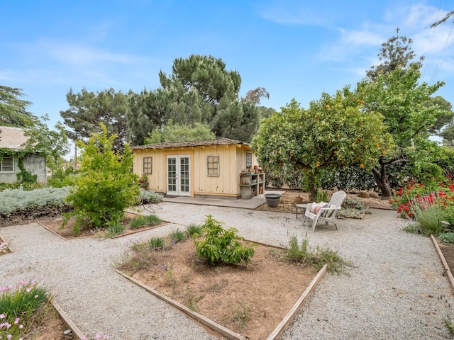 6043 N Forkner Ave, Fresno, CA 93711 - rear view of property featuring french doors, a patio, and board and batten siding