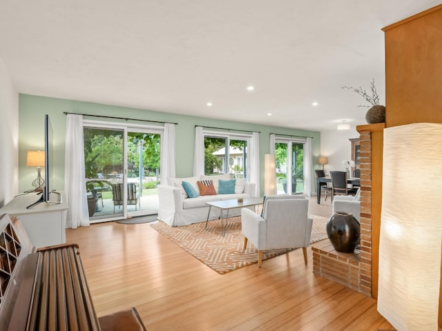 6043 N Forkner Ave, Fresno, CA 93711 - living room featuring wood finished floors and recessed lighting