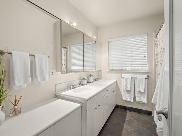 6043 N Forkner Ave, Fresno, CA 93711 - full bath featuring tile patterned floors, double vanity, baseboards, and curtained shower