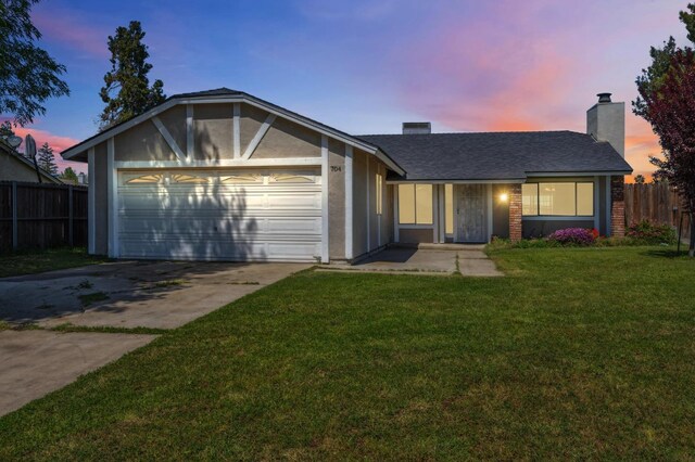 704 Rosehill Dr, Chowchilla, CA 93610 - ranch-style house with fence, a front lawn, an attached garage, a chimney, and concrete driveway