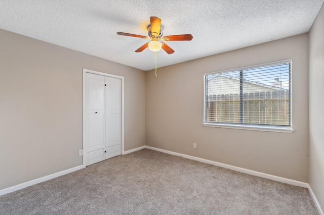 704 Rosehill Dr, Chowchilla, CA 93610 - carpeted spare room with a textured ceiling, ceiling fan, and baseboards