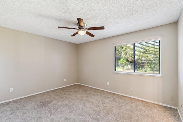 704 Rosehill Dr, Chowchilla, CA 93610 - carpeted spare room with baseboards, a ceiling fan, and a textured ceiling