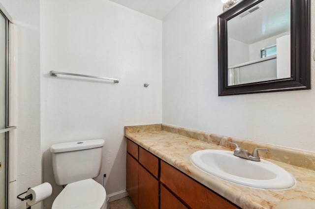 704 Rosehill Dr, Chowchilla, CA 93610 - bathroom with toilet, a shower with shower door, vanity, and visible vents