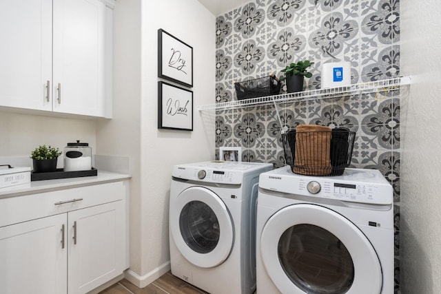 1899 N Apricot Ave, Fresno, CA 93727 - laundry room featuring washer and dryer, cabinet space, and wood finished floors
