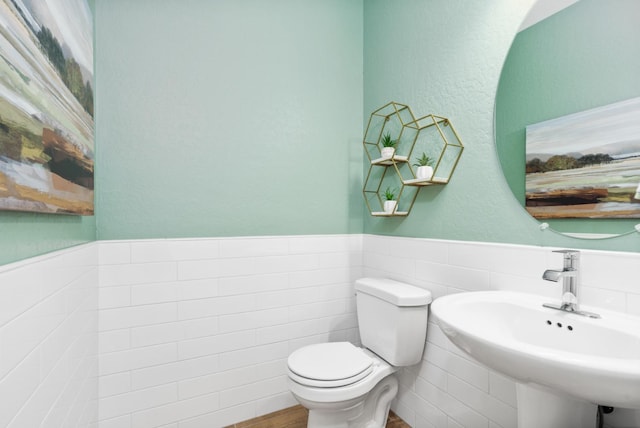 2110 N Brindac Ln, Clovis, CA 93619 - half bath with wainscoting, tile walls, and a textured wall