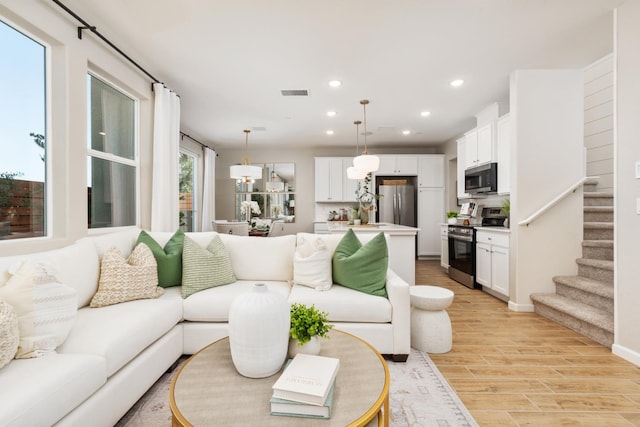 2110 N Brindac Ln, Clovis, CA 93619 - living area featuring recessed lighting, light wood-style floors, and stairs
