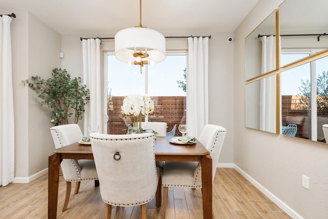2110 N Brindac Ln, Clovis, CA 93619 - dining room featuring wood finished floors and a chandelier