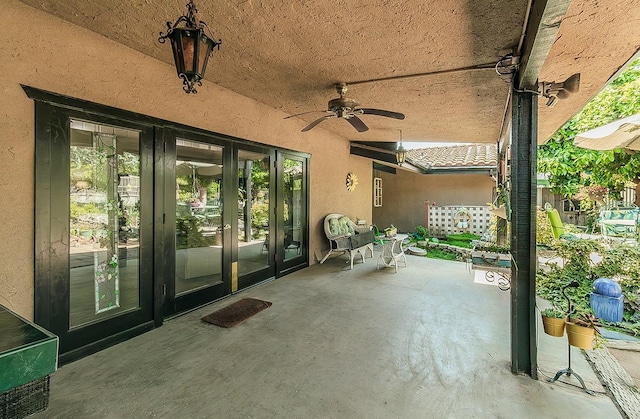 view of patio / terrace featuring french doors and a ceiling fan