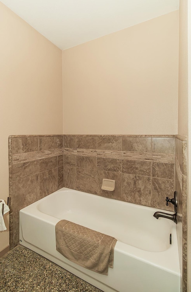full bathroom with a bath
