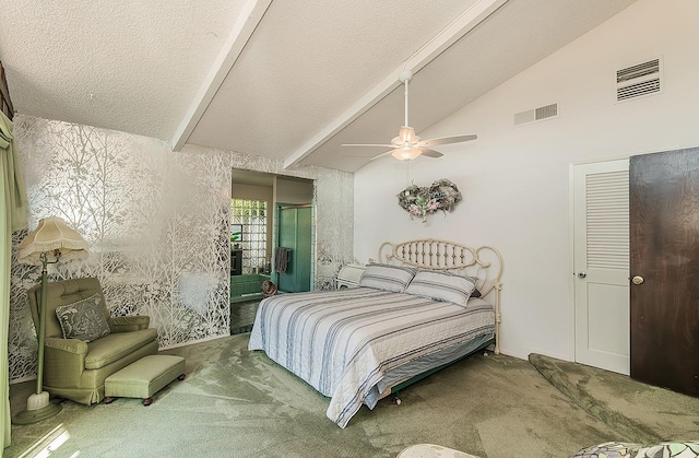 bedroom with a ceiling fan, carpet flooring, lofted ceiling, and visible vents