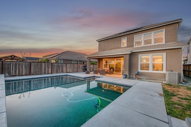 view of swimming pool with a fenced in pool, central AC, a fenced backyard, a patio area, and an outdoor living space