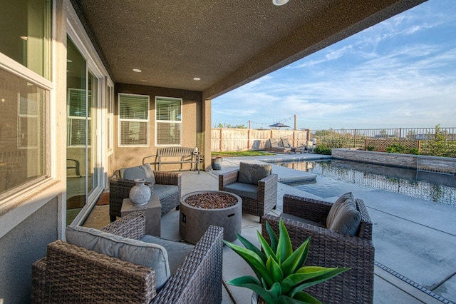 view of patio / terrace with an outdoor hangout area, a fenced in pool, and a fenced backyard