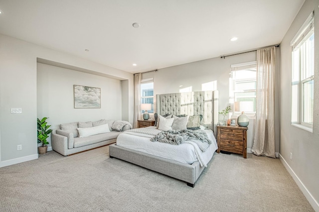 bedroom featuring carpet and multiple windows