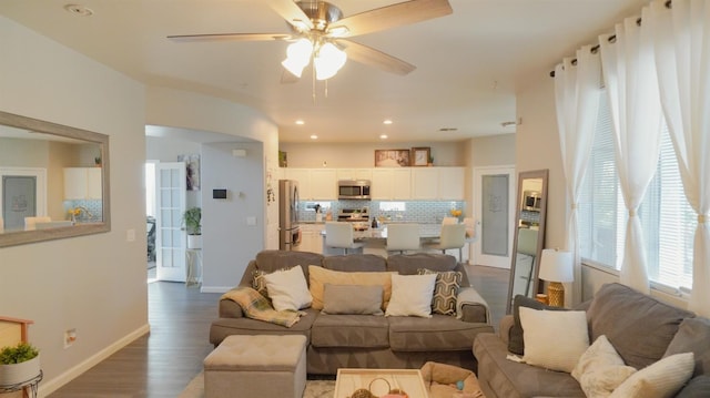 living room with recessed lighting, baseboards, a ceiling fan, and dark wood finished floors