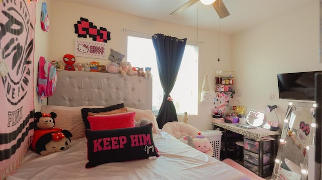 bedroom with multiple windows and ceiling fan