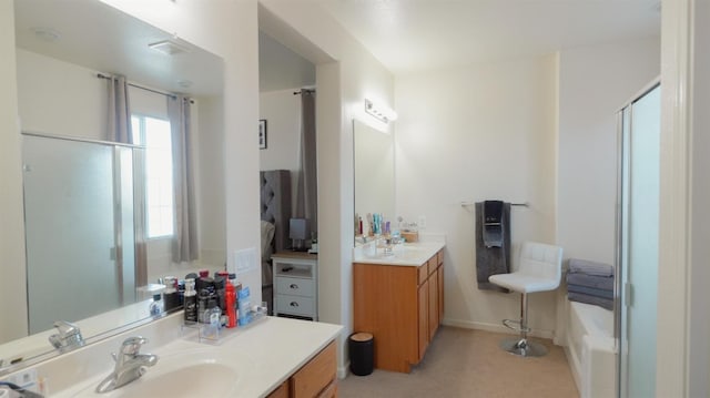 full bathroom with a shower with shower door, two vanities, a sink, and a washtub