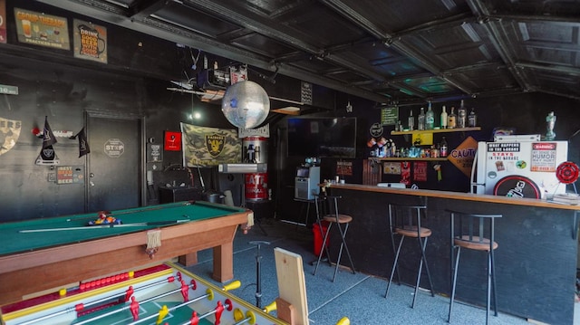 recreation room featuring a bar and billiards