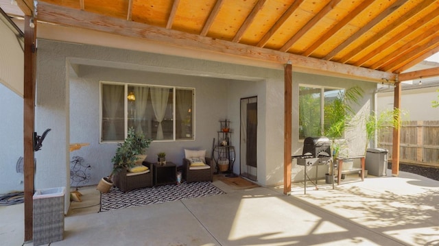 view of patio / terrace featuring fence