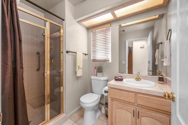 6305 N Marty Ave, Fresno, CA 93711 - full bathroom with a shower stall, tile patterned floors, vanity, and toilet