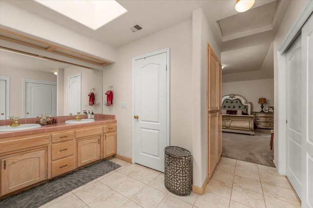 6305 N Marty Ave, Fresno, CA 93711 - full bathroom with a sink, visible vents, double vanity, and tile patterned flooring