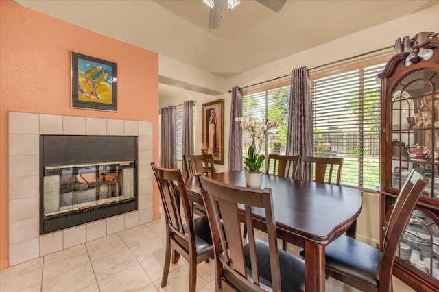 6305 N Marty Ave, Fresno, CA 93711 - dining space featuring a ceiling fan, light tile patterned flooring, and a fireplace