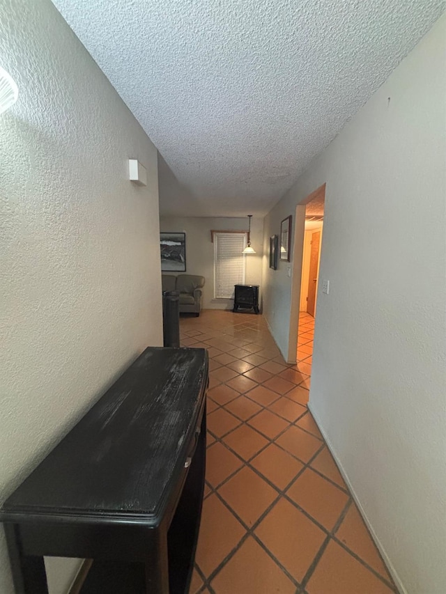 1225 Pontiac Ave, Clovis, CA 93612 - corridor featuring a textured ceiling, tile patterned floors, and a textured wall