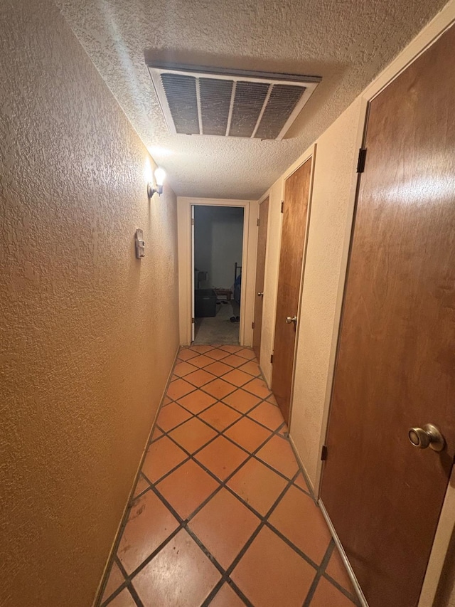 1225 Pontiac Ave, Clovis, CA 93612 - hall featuring a textured wall and a textured ceiling